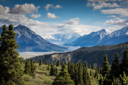 green mountain across body of water