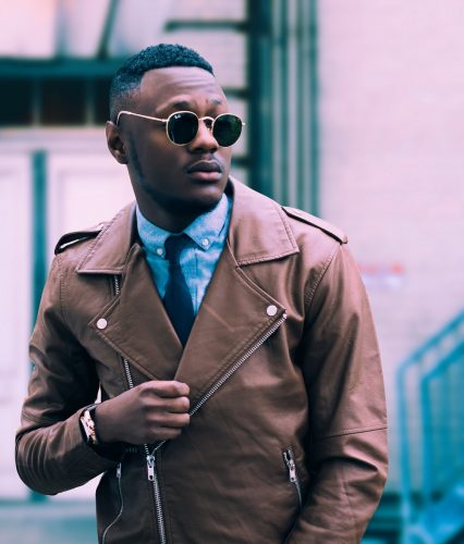 man in brown leather coat