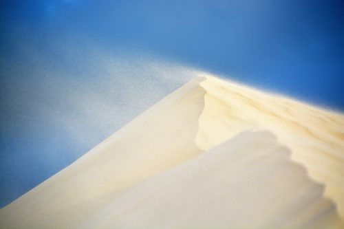 white sand under blue sky during daytime