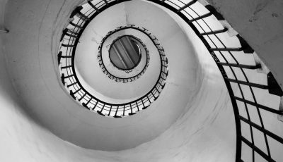 white spiral staircase with black metal railings